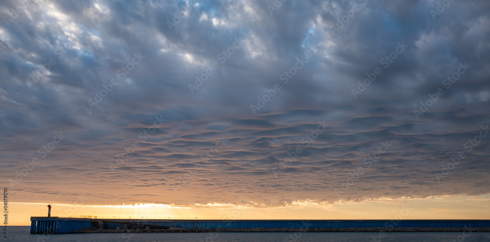 Amazing clouds in the sky and rays of the setting sun Amazing clouds in the sky and rays of the setting sun