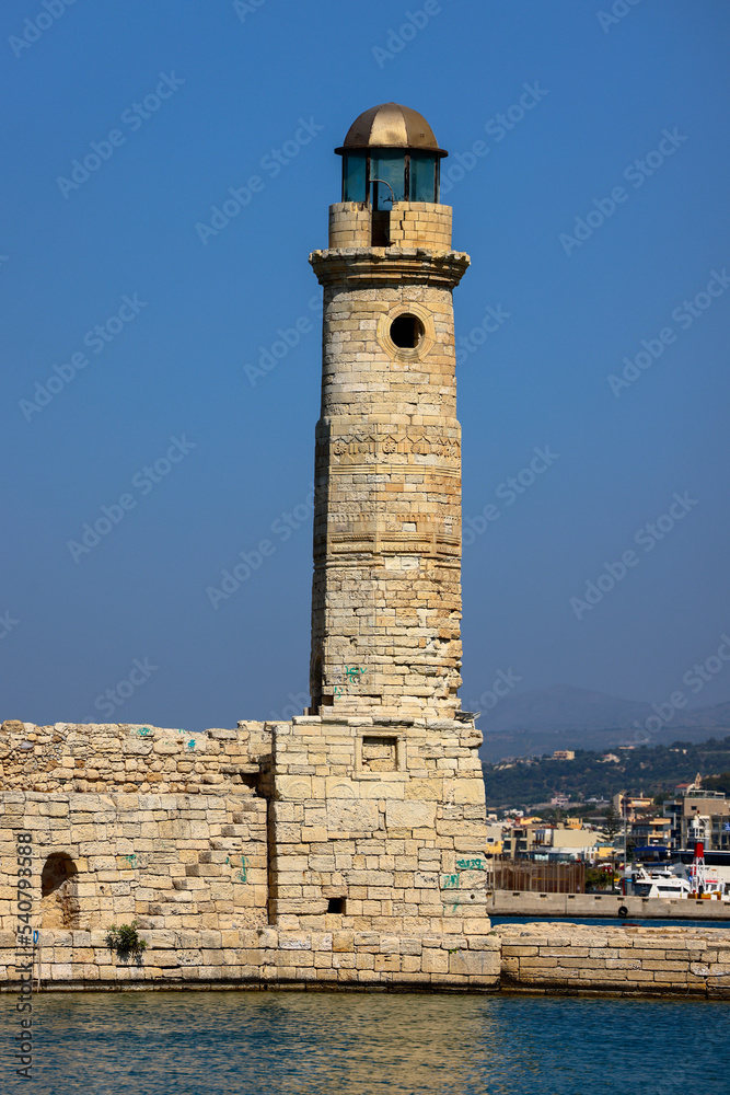 Egyptian Rethymno lighthouse on the Venetian old harbour. Crete, Greece.