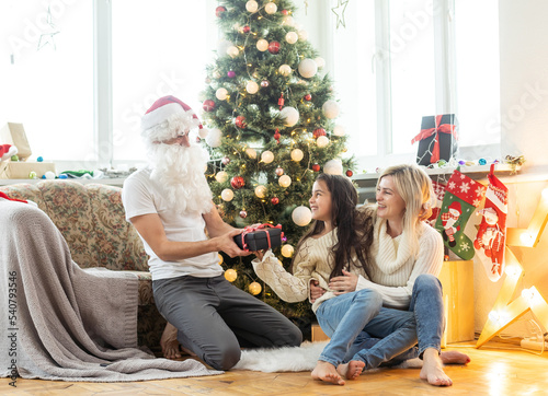family and father in Santa costume, Christmas © Angelov
