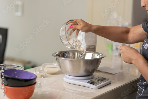 Scale with a bowl with flour in a Mexican kitchen counter, to make bread