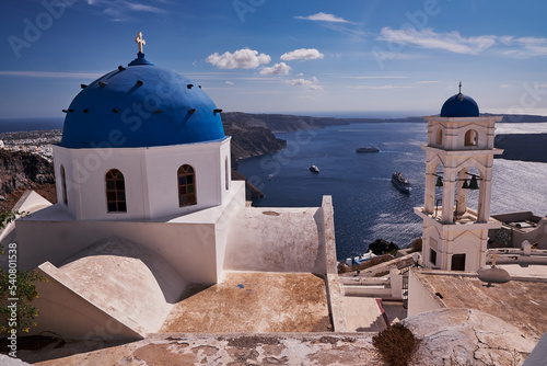 Anastasis Church with its Blue Dome and Tower in Imerovigli village, Santorini, Greece photo