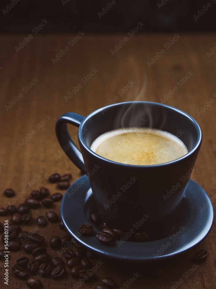 Coffee cup on a brown wooden table Coffee cup on a brown wooden table