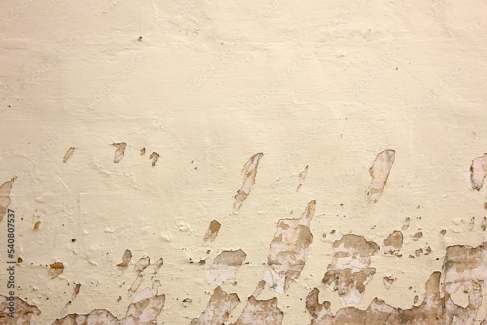 Fototapeta premium Old paint on the dirty cement wall background. Wall with shabby damaged plaster. Texture, pattern, background. Copy space.