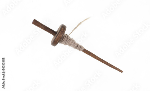 vintage spindle in thread isolated on white background photo