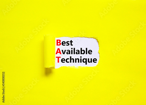 BAT best available technique symbol. Concept words BAT best available technique on white paper on a beautiful yellow background. Business and BAT best available technique concept. Copy space.