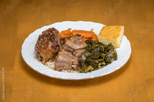 Oxtails with Greens Corn Bread and Yams