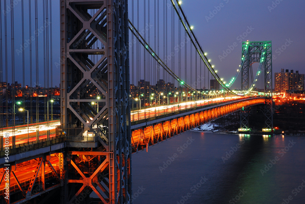 Fototapeta premium George Washington Bridge carries night traffic over the Hudson River and Connects Fort Lee New Jersey with New York City