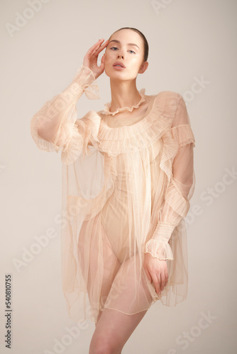 Sexy model in transparent dress.