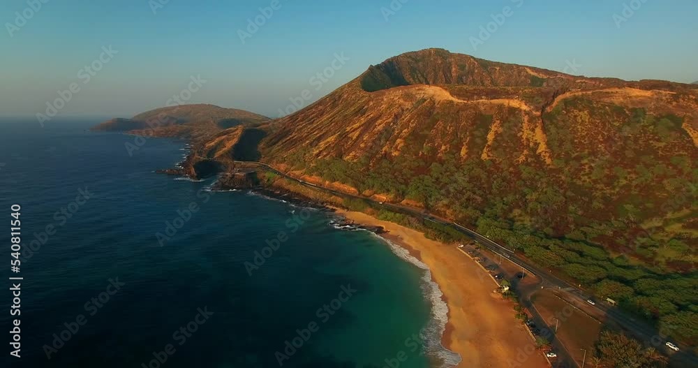Aerial: Aerial Shot Of Cars Vehicles Moving On Oahu Island. Drone Flying Backwards Over Seashore At Beach Aerial: Aerial Shot Of Cars Vehicles Moving On Oahu Island. Drone Flying Backwards Over Seashore At Beach