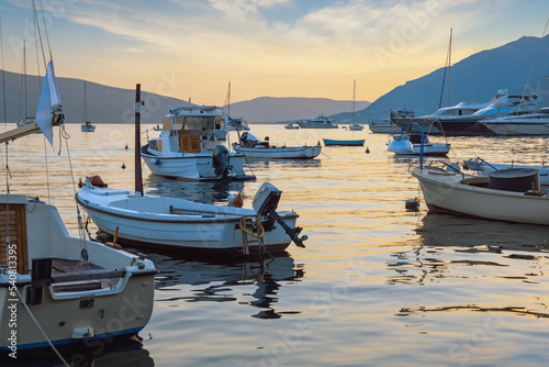 Evening Mediterranean landscape with boats on water. Montenegro,  Kotor Bay, Tivat © Olga Iljinich