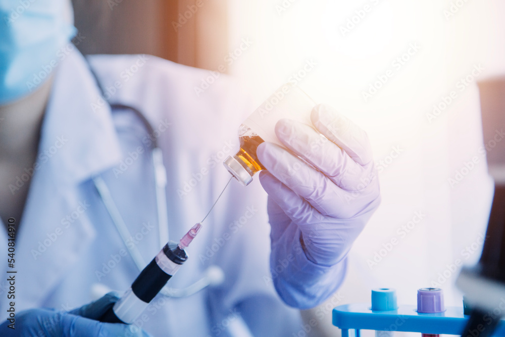 biochemical research scientist team working with microscope for coronavirus vaccine development in pharmaceutical research labolatory, selective focus biochemical research scientist team working with microscope for coronavirus vaccine development in pharmaceutical research labolatory, selective focus