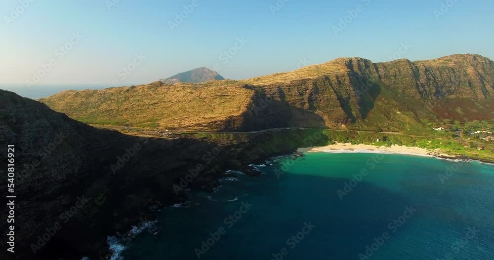 Aerial: Aerial Beautiful View Of Natural Rock Formations Against Clear Sky, Drone Flying Forward Over Sea On Sunny Day - Oahu, Hawaii