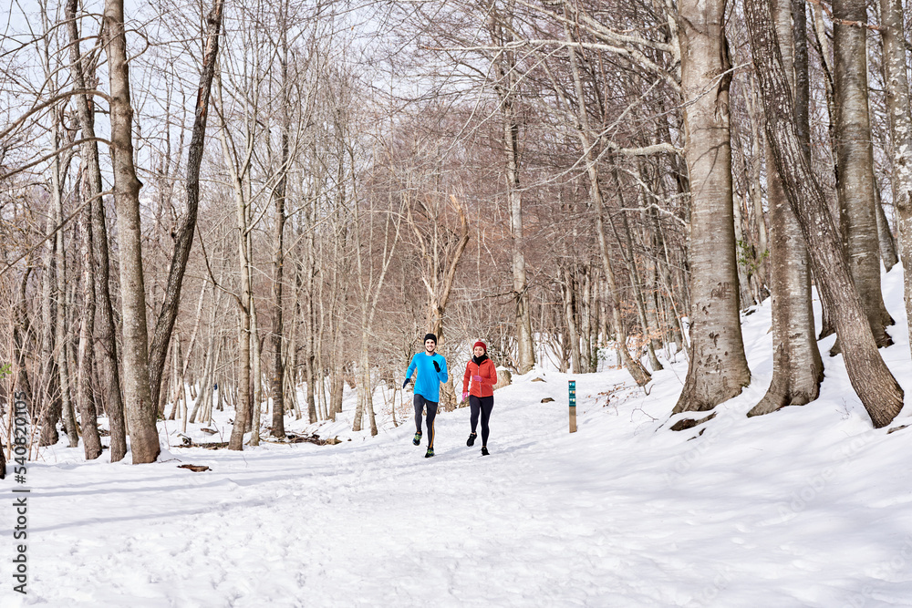 Couple jogging in winter morning