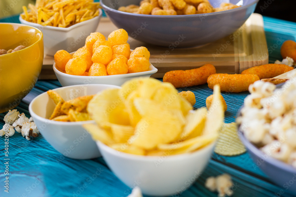 Beer salty snacks on wooden table Beer salty snacks on wooden table
