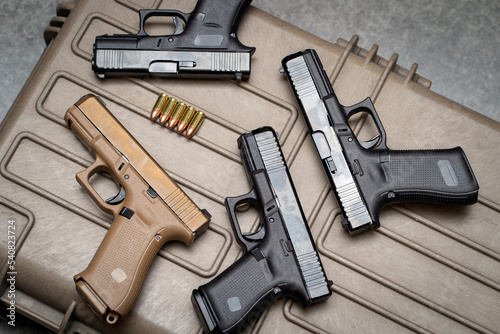 Weapons, many 9mm pistols close-up. photo