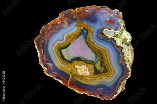 A cross section of the agate stone. Multicolored agate with a unique contrasting pattern and pseudomorphosis. Origin: Morocco, High Atlas area around Aquim.