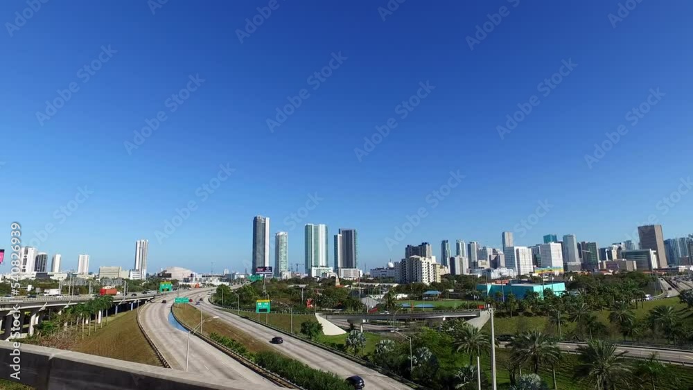Point Of View Of Modern Buildings In Residential City Against Clear Sky On Sunny Day - Miami, Florida Point Of View Of Modern Buildings In Residential City Against Clear Sky On Sunny Day - Miami, Florida