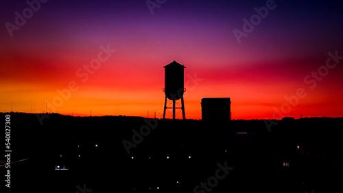Sunset over water tower and buildings in downtown Columbus, Georgia