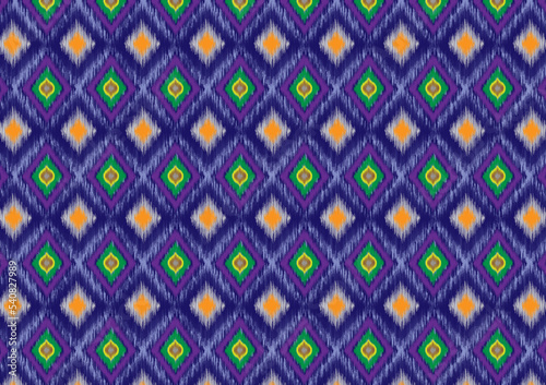 Multi-colored diamond-shaped triangles with ikat fabrics laid on top of each other, arranged sideways, looking elegant and elegant on a blue background.