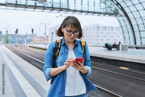 Woman passenger of urban rail transport at modern train station