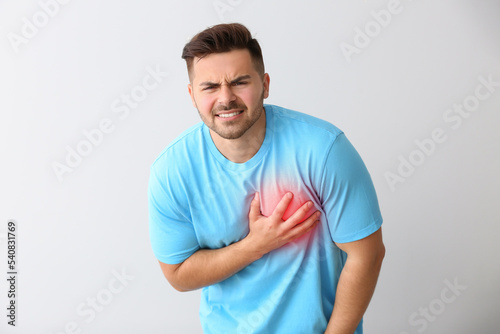 Young man having heart atta...