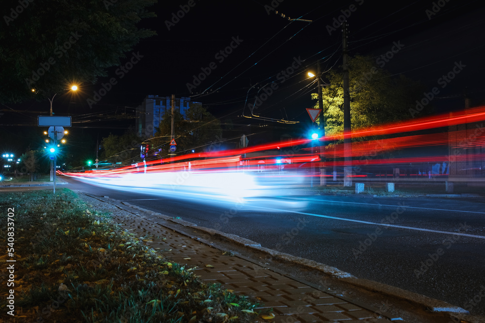 Fototapeta premium View of city road with street lights at night