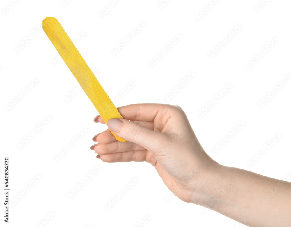 Female hand with yellow ice cream stick on white background Female hand with yellow ice cream stick on white background