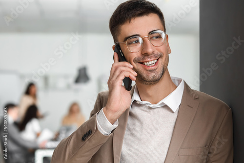 Handsome businessman talkin...