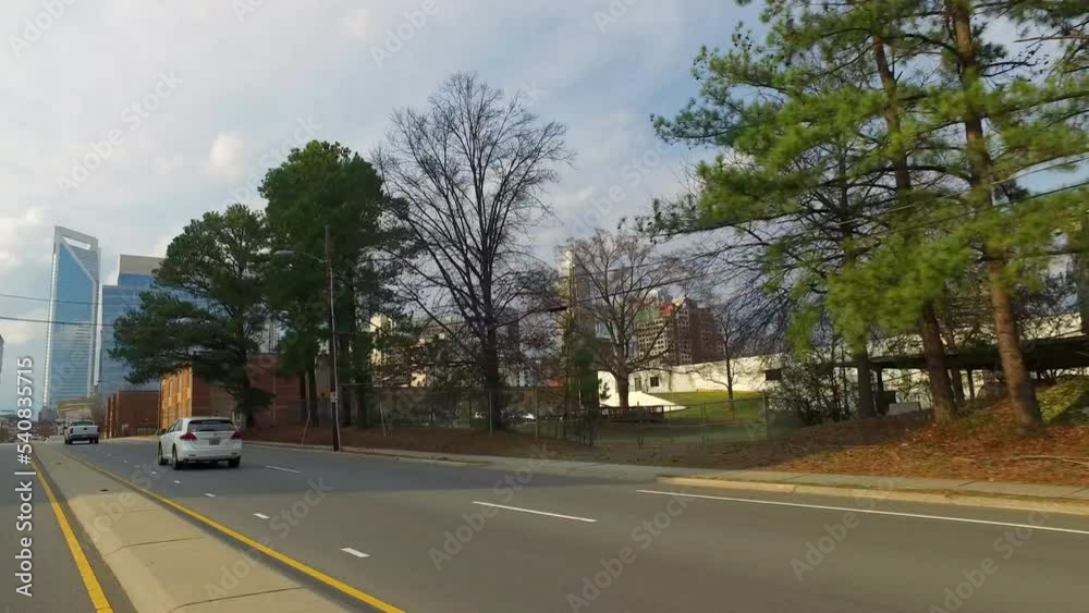 Vehicles Moving On Road By Modern Buildings In City - Charlotte, North Carolina Vehicles Moving On Road By Modern Buildings In City - Charlotte, North Carolina