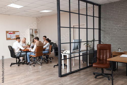Business co-workers having meeting in office photo