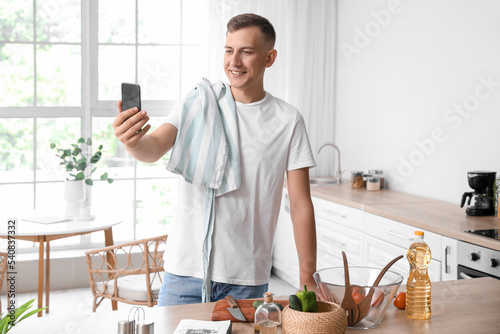 Young man with mobile phone...