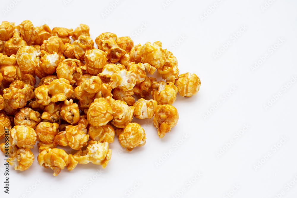 Honey caramel popcorn on white background. Honey caramel popcorn on white background.