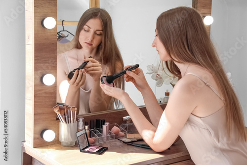 Young woman with makeup bru...