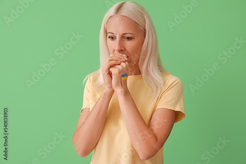 Mature woman with drawn fla...