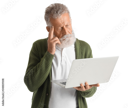 Thoughtful mature man using...