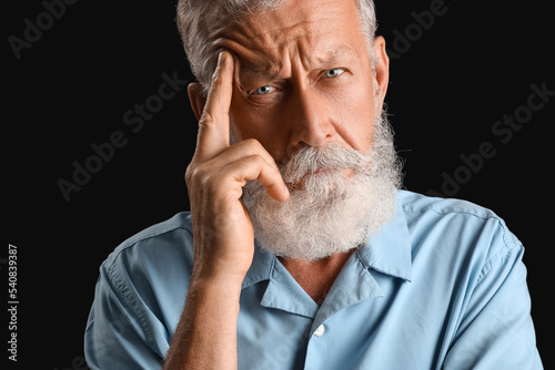Thoughtful mature man on bl...