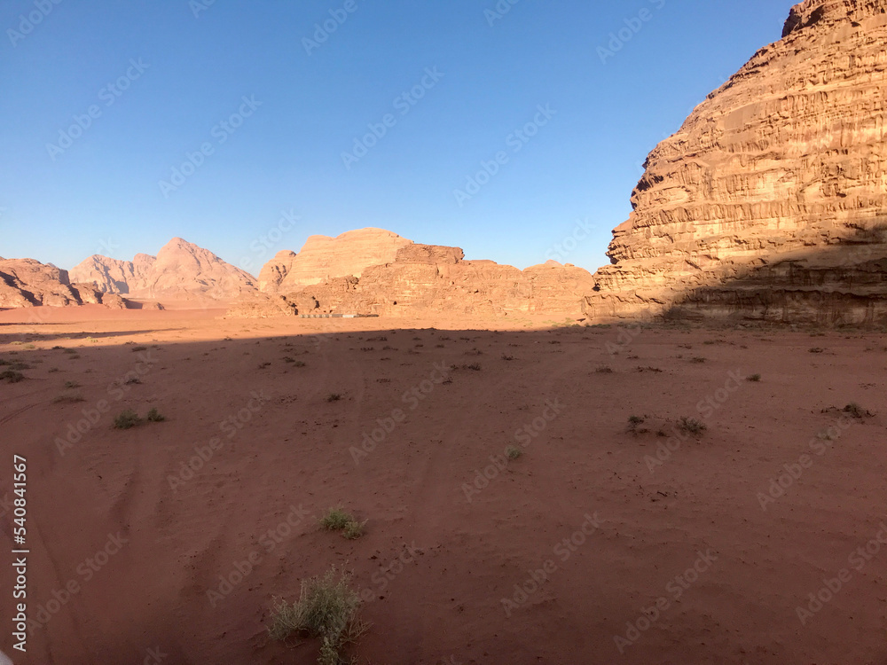 Wadi Rum, Jordan, November 2019 - A large brick building with a mountain in the desert