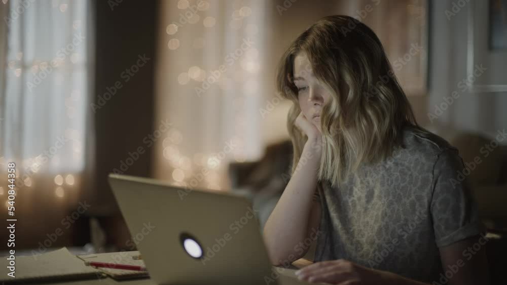 Girl falling asleep while studying on laptop at night / Cedar Hills, Utah, United States Girl falling asleep while studying on laptop at night / Cedar Hills, Utah, United States