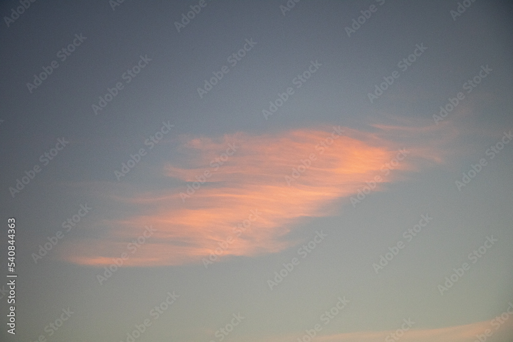 wispy clouds in the sunrise