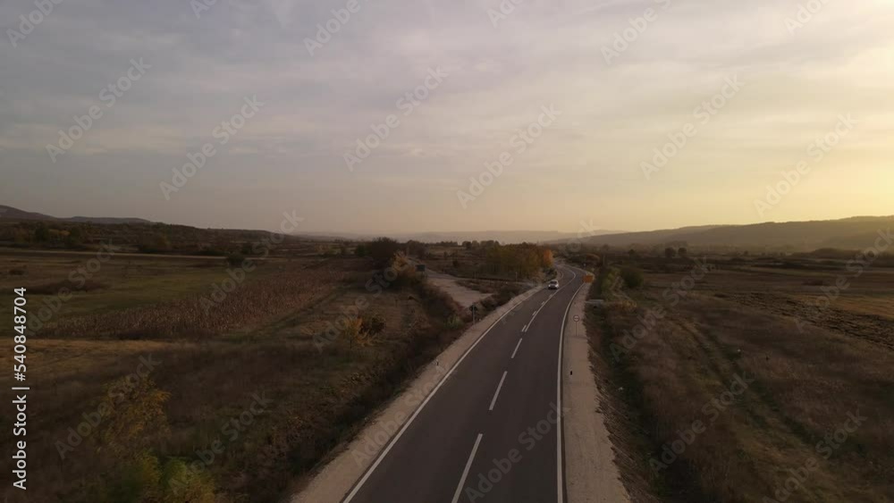 car drive on the road aerial drone view top down in autumn day car drive on the road aerial drone view top down in autumn day