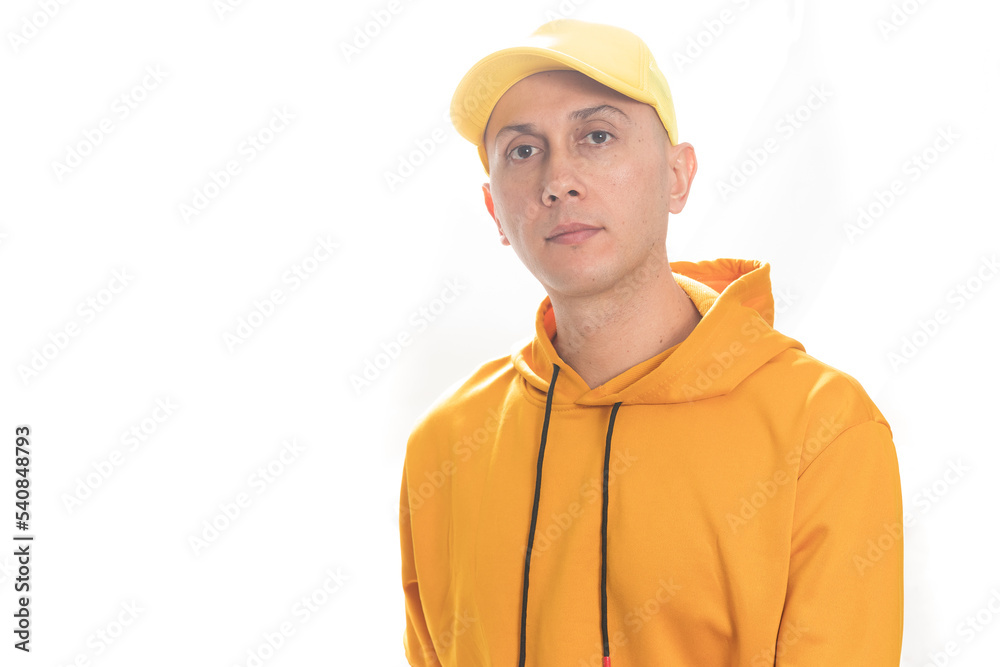 Adult latino man dressed in yellow