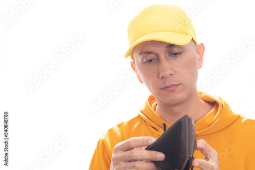 Latino man holding a wallet with no money photo