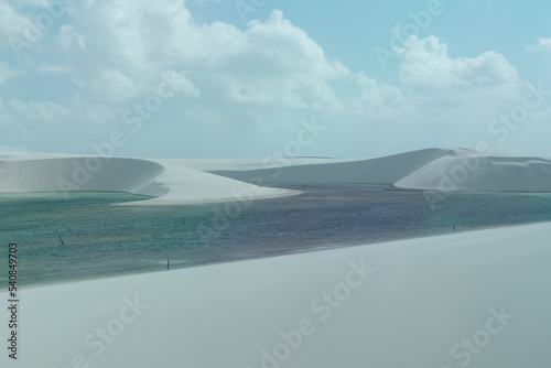 Lagoon with dune in the horizon  Len  ois Maranhenses  Brazil 