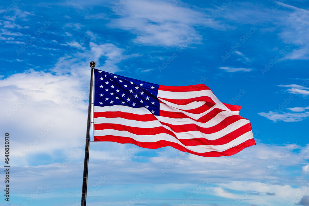 USA flag waving against sky USA flag waving against sky