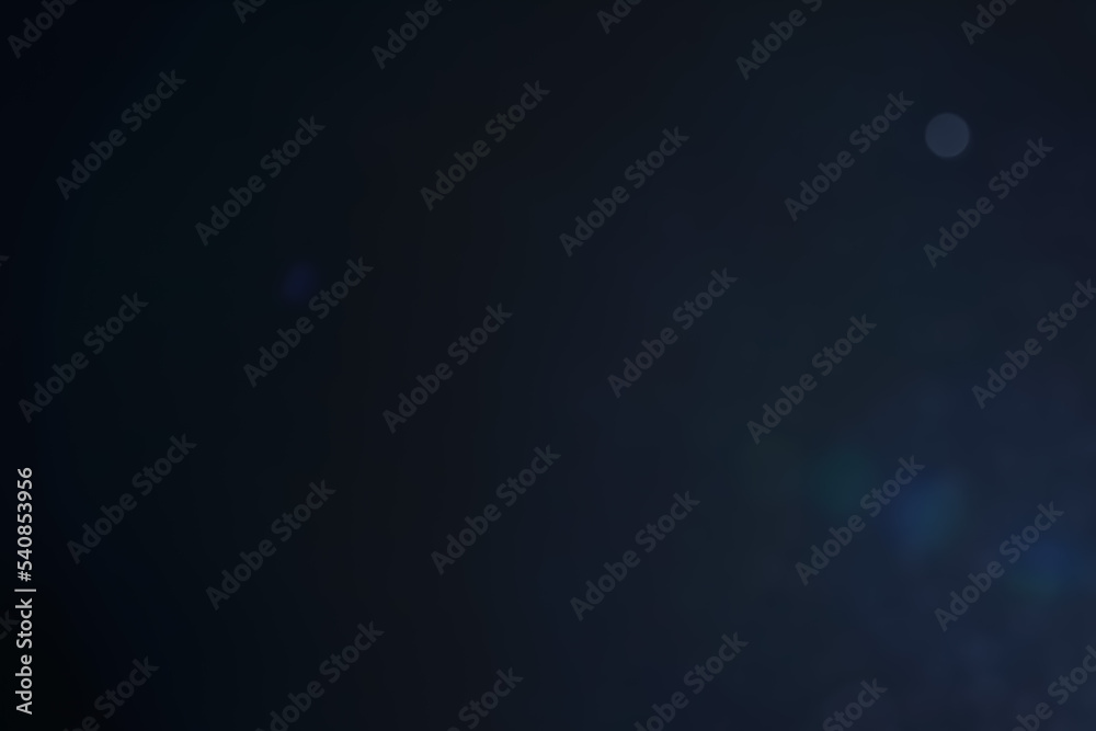 A dark blue background bokeh image for used to decorate background. A dark blue background bokeh image for used to decorate background.