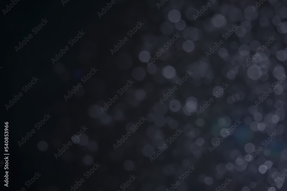 A dark blue background bokeh image for used to decorate background. A dark blue background bokeh image for used to decorate background.