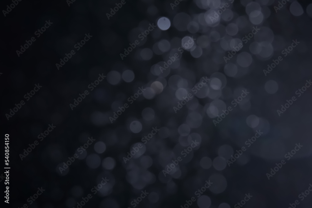A dark blue background bokeh image for used to decorate background.