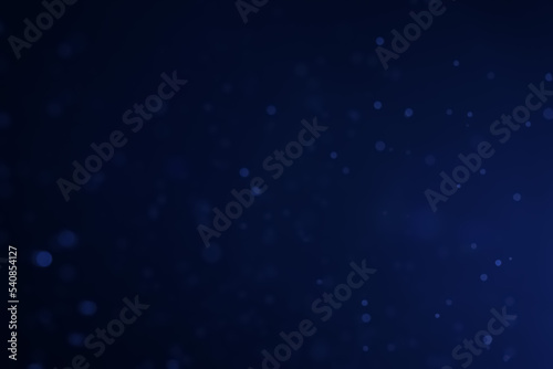A dark blue background bokeh image for used to decorate background.