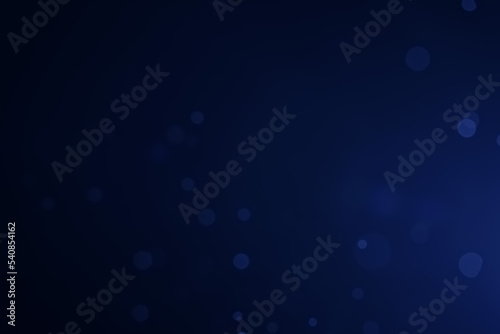 A dark blue background bokeh image for used to decorate background.