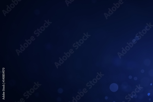 A dark blue background bokeh image for used to decorate background.